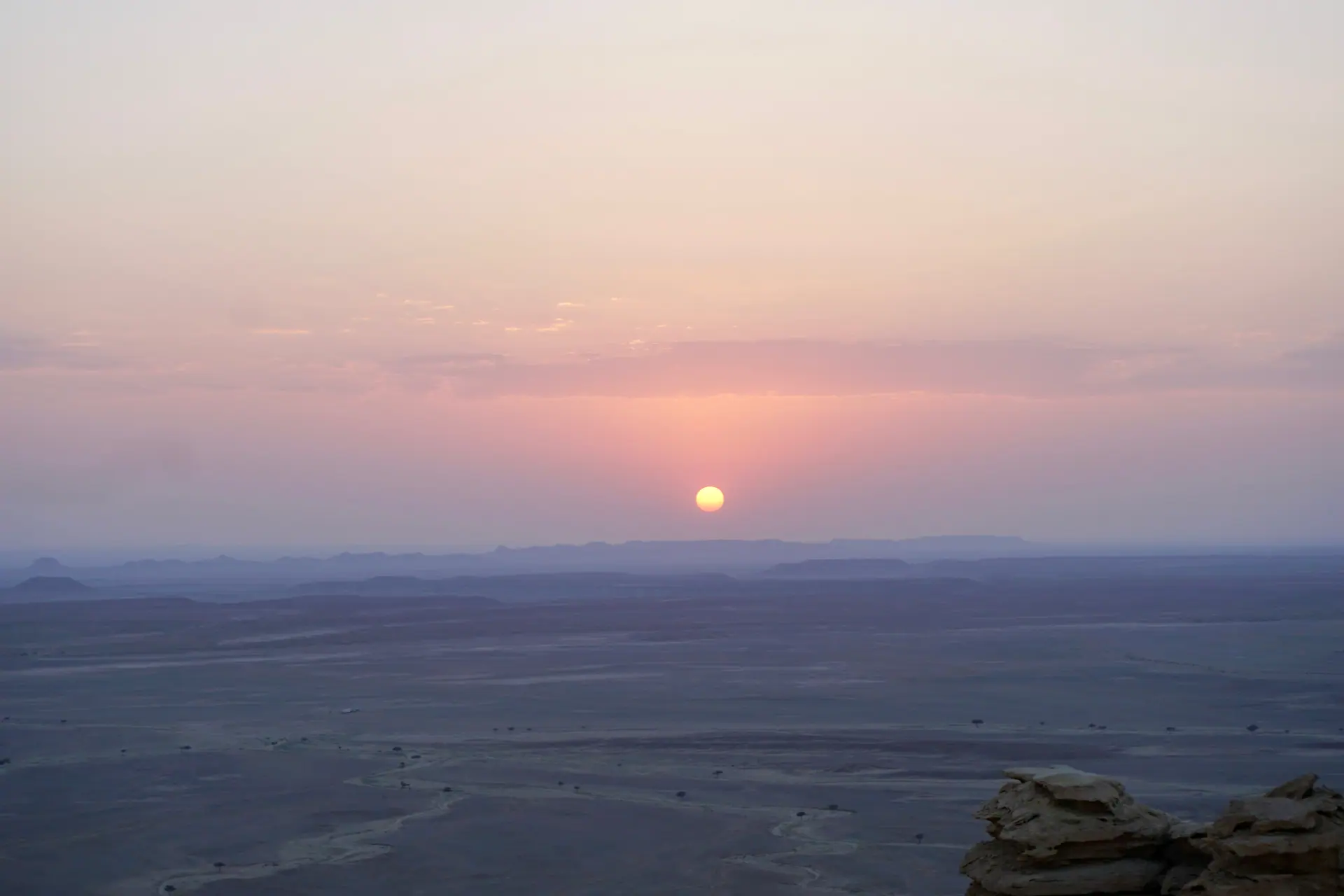Viator Modus travel creator overlooking a sweeping landscape